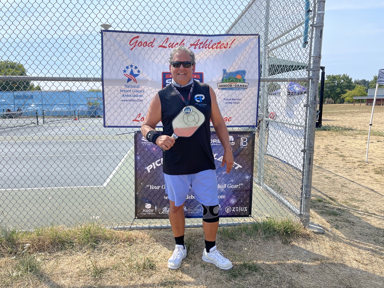 Ernie Ortiz with tournament medal